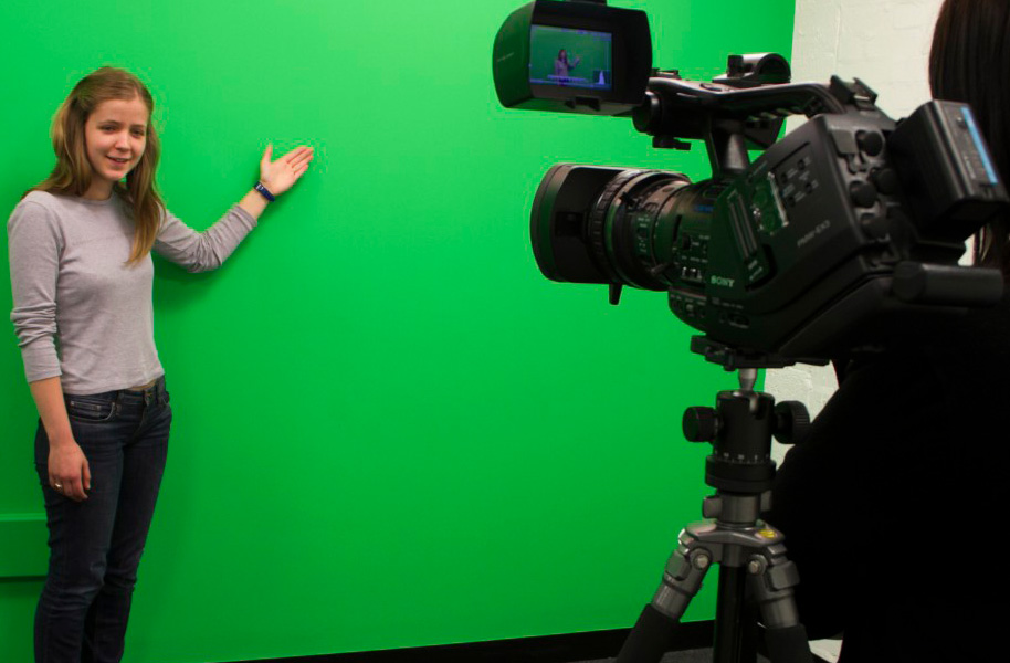Student recording with a green screen
